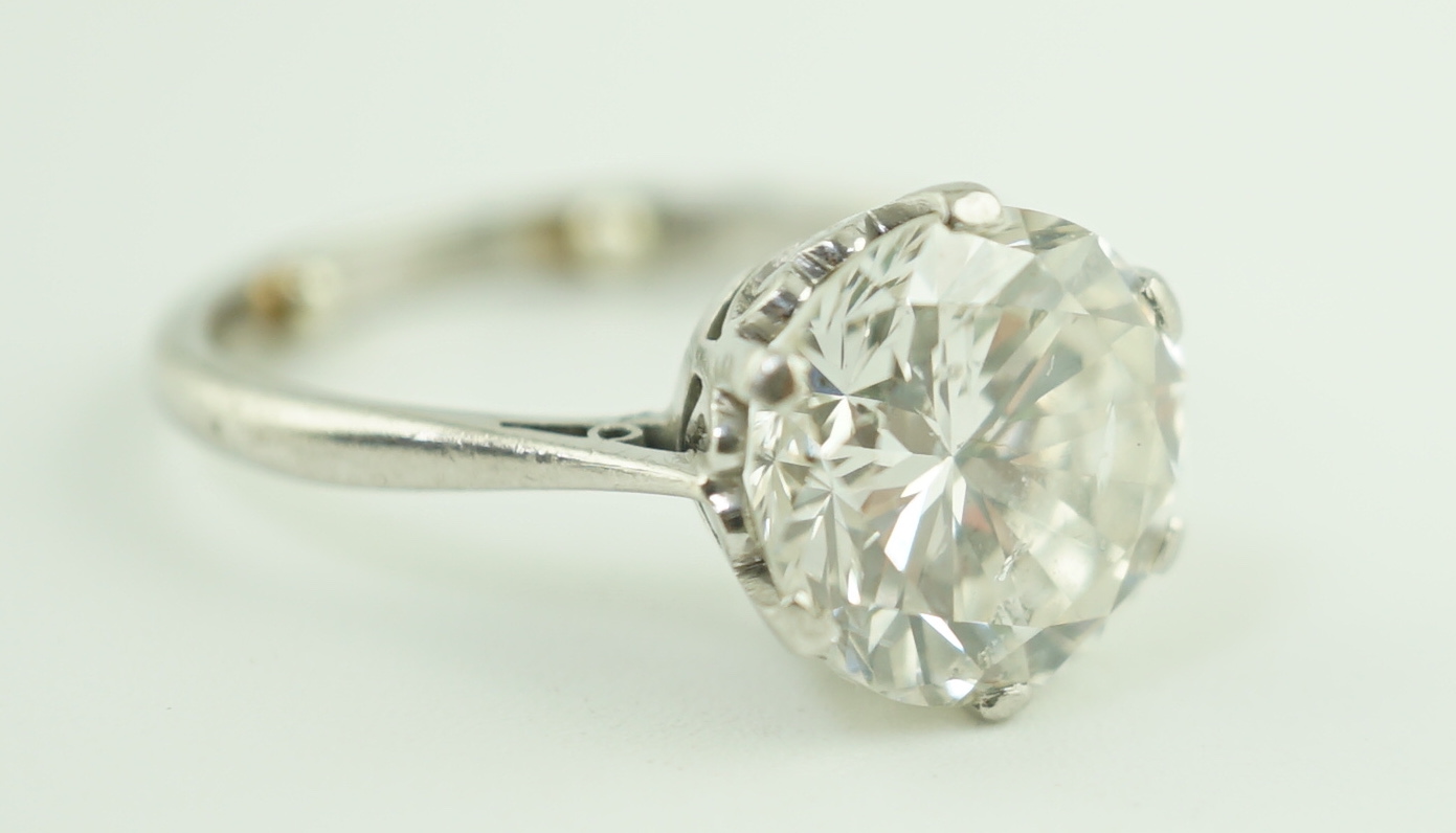 A mid 20th century platinum and solitaire diamond set ring